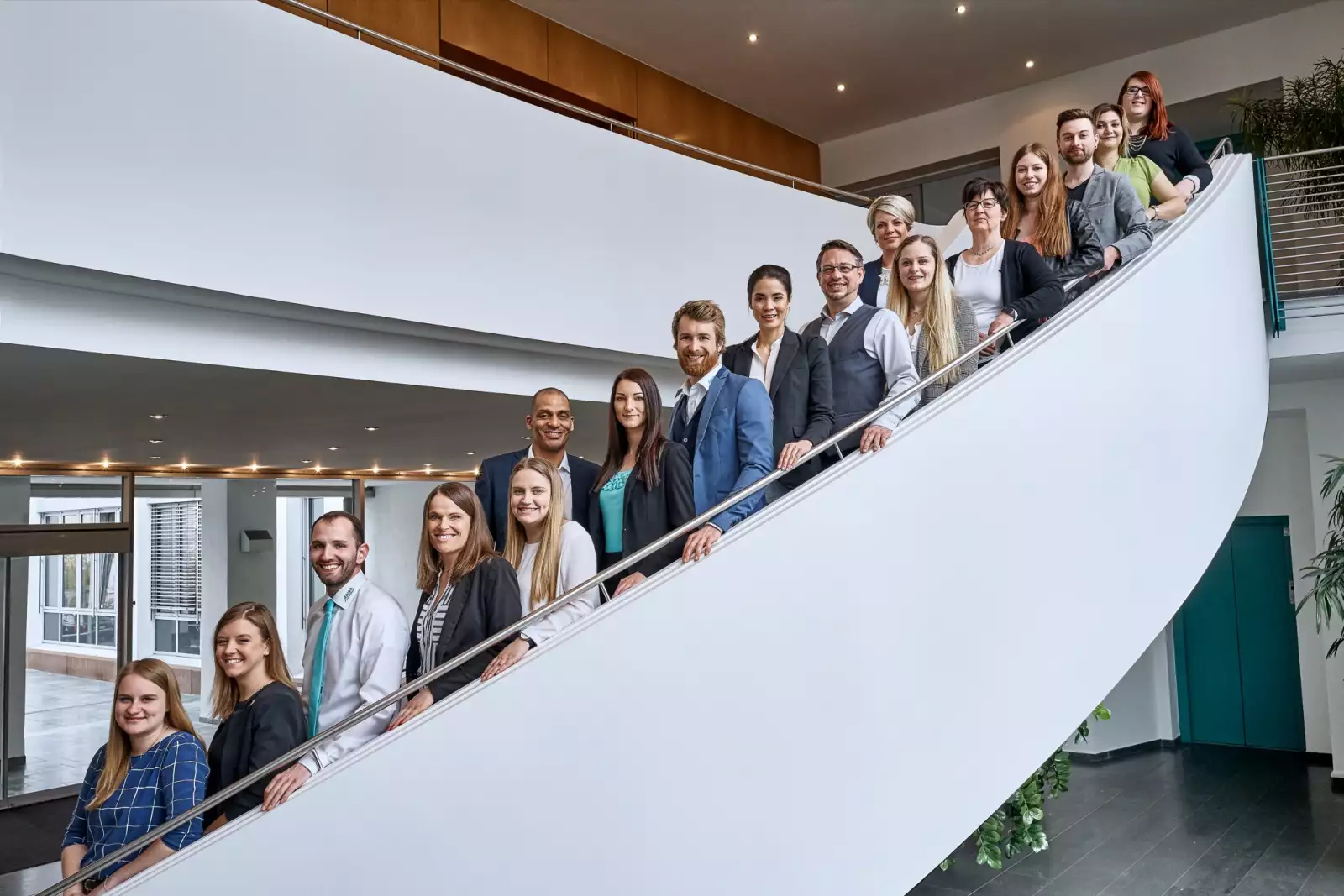ARWA colleagues on the stairs in the company building